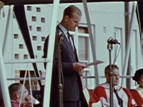 Prince Philip gives a speech at the opening on University House in Canberra in front of staff in academic dress