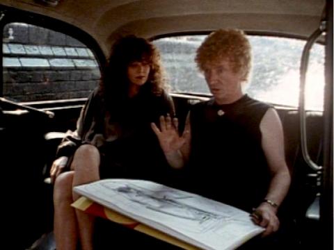 Brett Whiteley with a drawing on his lap and Janice Spencer in the back of a London cab