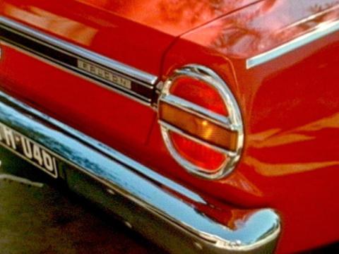 A close up of the rear of a red XT Falcon including tail lights and chrome bumper bar.