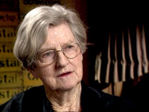 Artist Rosalie Gascoigne looking off camera at an interviewer. 