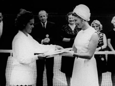 Evonne Goolagong accepts the Wimbledon trophy from Princess Alexandra