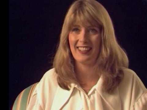 Australian singer Debbie Byrne, head and shoulders shot from 1992, smiling at camera.