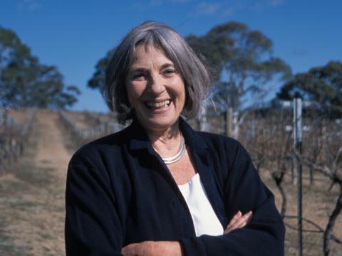 Betty Churcher standing in a vineyard