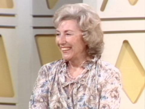 Dame Vera Lynn smiling, looking away from the camera.