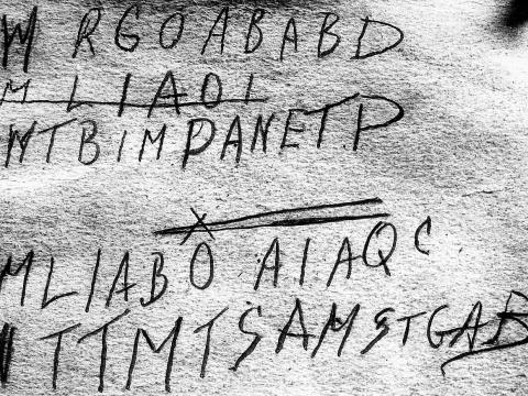 Part of a page from a book that has a handwritten code on it. The book was a piece of evidence in the 'Somerton Man' case from 1948