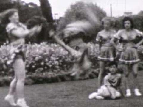 Female acrobats performing stunts