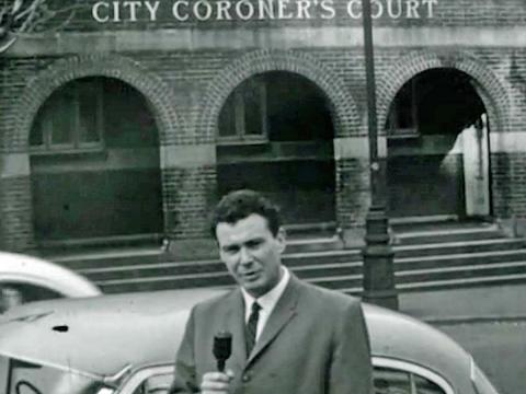 TV still of a news reporter on a street