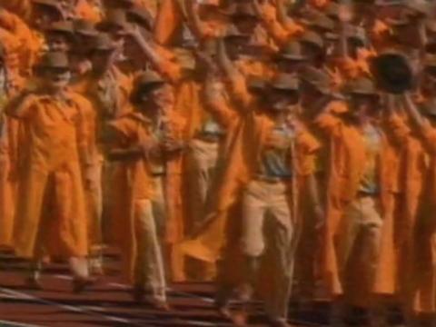 The Australian Olympic team at the opening ceremony wearing orange driza-bone coats and hats