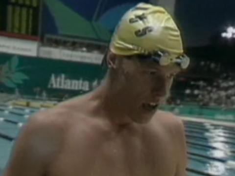 Keiren Perkins wearing a swimming cap by the pool