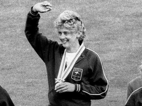 Betty Cuthbert breathing heavily after finishing her race