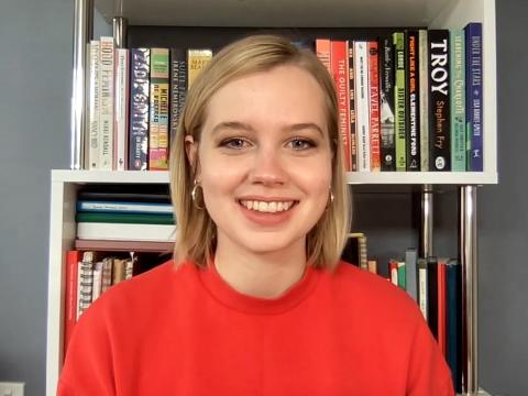 Head and shoulders shot of actor Angourie Rice smiling at camera