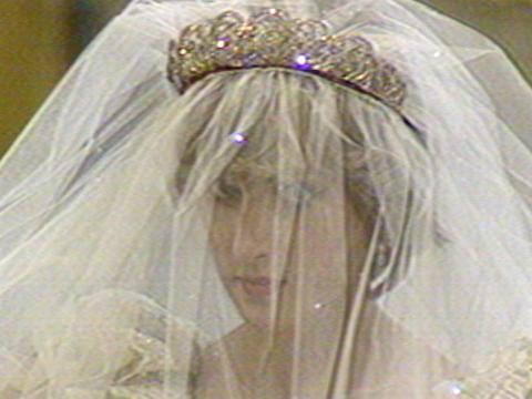 Lady Diana Spencer wearing a veil and tiara as she walks down the aisle in St Pauls Cathedral about to marry Charles, Prince of Wales.