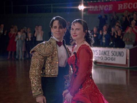 Paul Mercurio and Tara Morice in the film Strictly Ballroom. They are dressed in Spanish style dancing costumes.