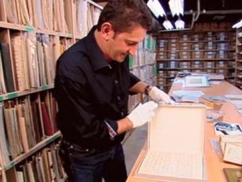 Warren Brown looks at an original sheet music manuscript for Waltzing Matilda at the National Library of Australia.