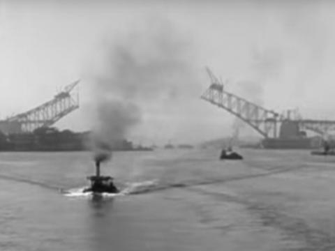 The Sydney Harbour Bridge partially finished