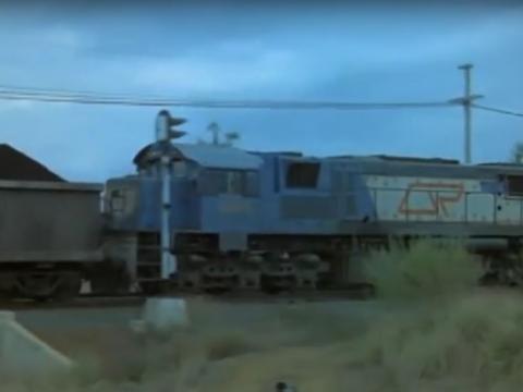 A train passes by a crossing
