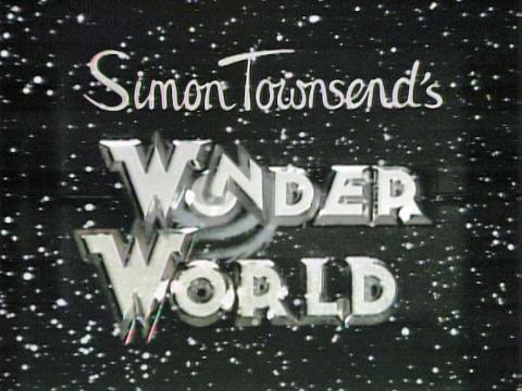 The words 'Simon Townsend's Wonder World' in silver writing against a black starry background. Image is the opening title card for a kid's television show.