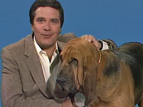 Simon Townsend and his dog Woodrow facing camera and smiling