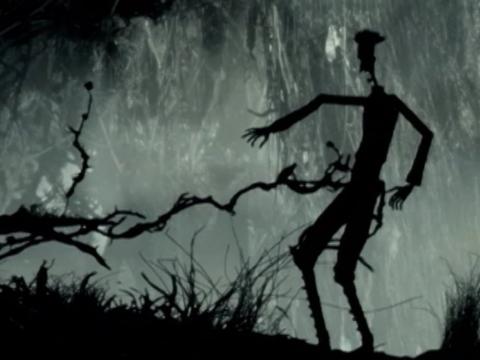 Animation still of a silhoetted figure against a spooky landscape.