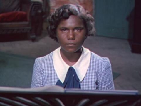 Young Indigenous girl wearing a school uniform