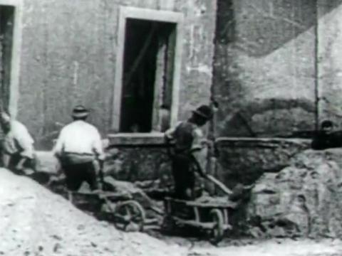  Demolition workers filmed in 1899 in Brisbane, Queensland, carrying rubble away in wheelbarrows