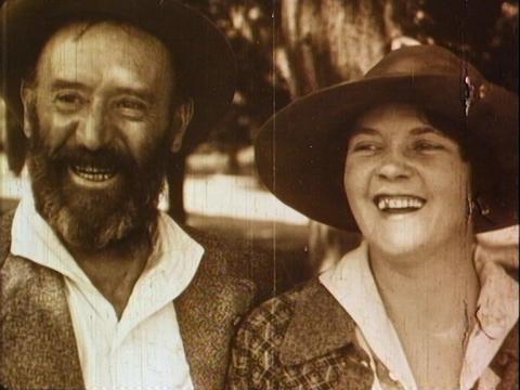Mr and Mrs F Dean smile at the camera after completing their tour of Australia