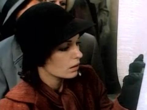 Film still of Helen Morse as Caddie looking at job vacancies during the Great Depression.