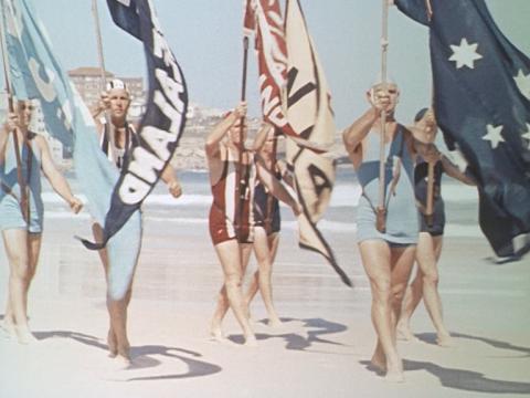 Surfers parade on Bondi beach