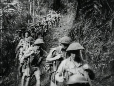 Australian soldiers march along the Kokoda track