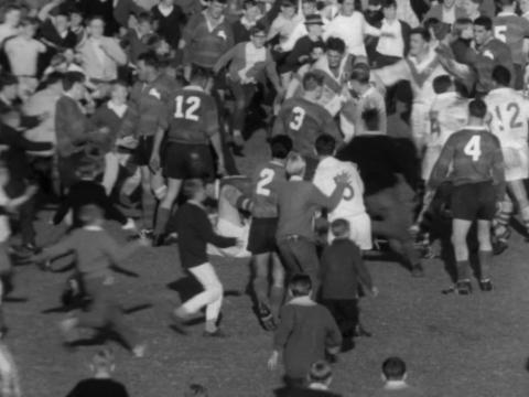 Crowds rush the field at the end of the 1965 Rugby League grand final