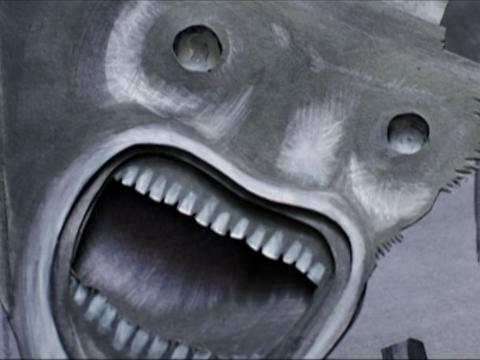 Big close up of a screaming, monstrous cartoon face.