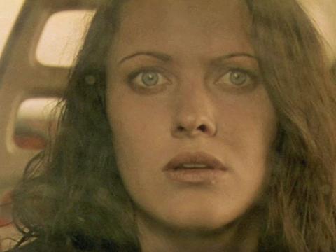 Big close up of a woman looking scared