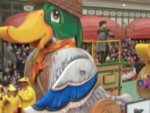 A giant duck float in New York featured in the Macy's Thanksgiving Day Parade in 2020. Kylie Minogue is standing on the back of the float singing. 