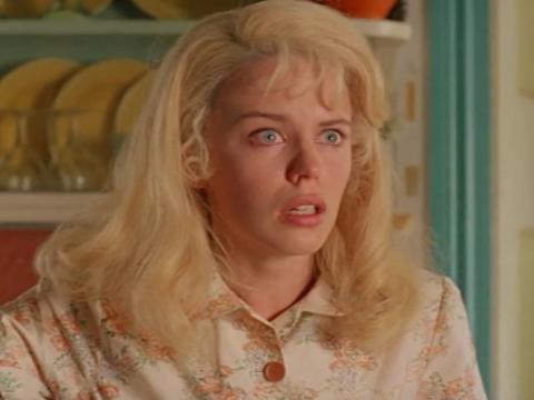 Kylie Minogue looks shocked as Lola in The Delinquents.