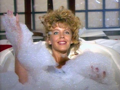 Kylie Minogue in a bathtub full of bubbles