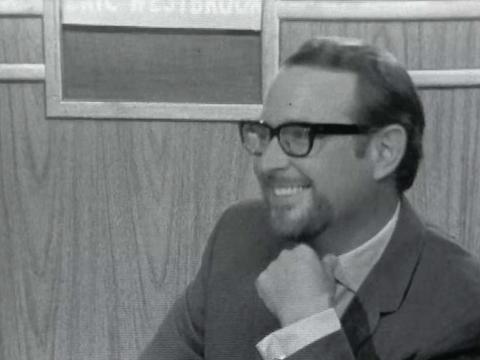 Head and shoulders shot of Brian Henderson who is smiling at something off camera