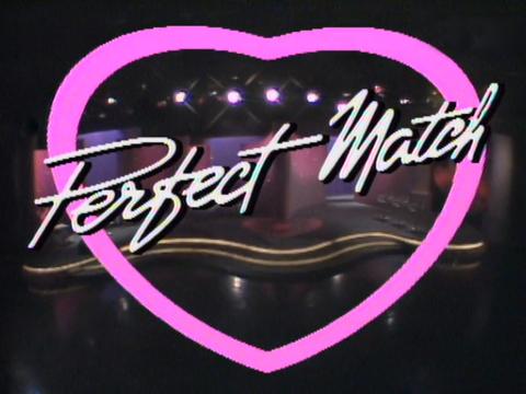 A screen with a big pink love heart on it with the words Perfect Match overlaid on the heart.