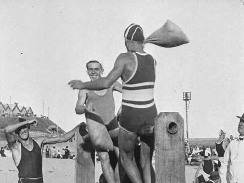 Two surfers compete in a game at the Newcastle surf carnival in 1920