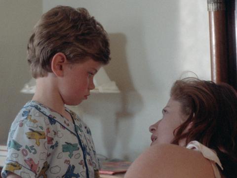 Still image from the film Proof shows a young Martin looking at his mother.