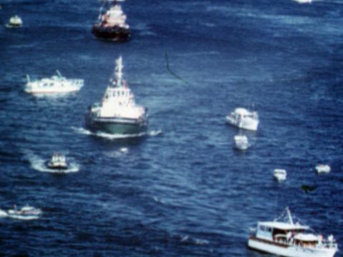 Eleven boats of differing sizes and types on the water.