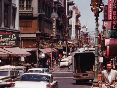 A busy street scene in 1950s San Francisco.