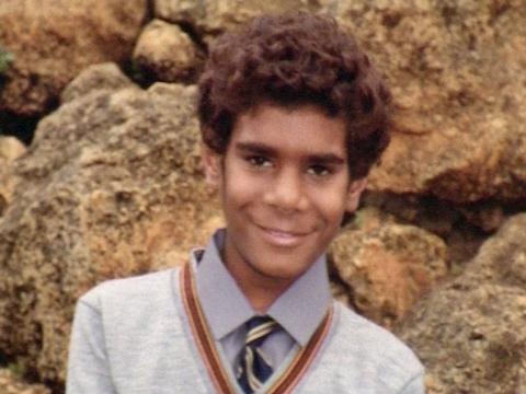 A young man in school uniform