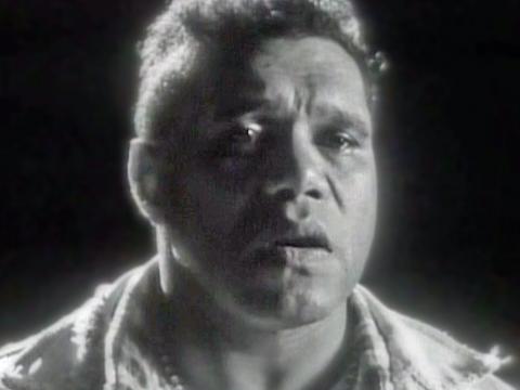 Close up black and white shot of Archie Roach