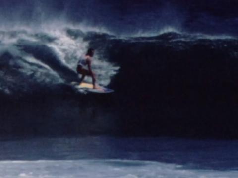 Surfer on a large wave