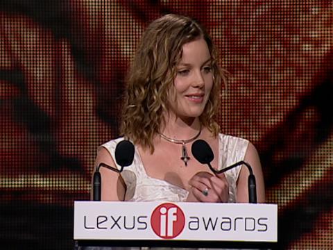 Abbie Cornish accepts an award. She is standing at a podium that has 'Lexus IF Awards' written on it.