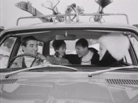 Four young people sit in a Holden car