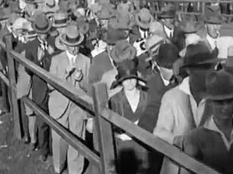 A black and white photo of a crowd of people