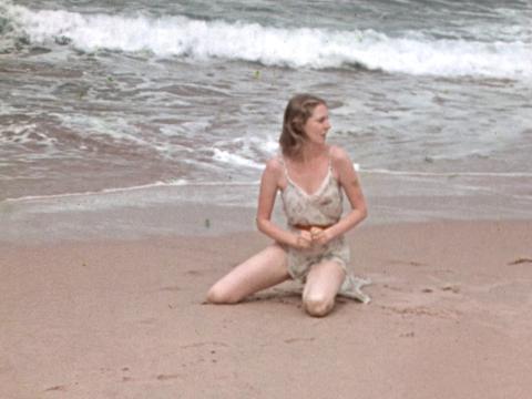 Screenshot from home movie showing a dancer from Ballet Russes on the shore at Bungan Beach. Circa 1939.