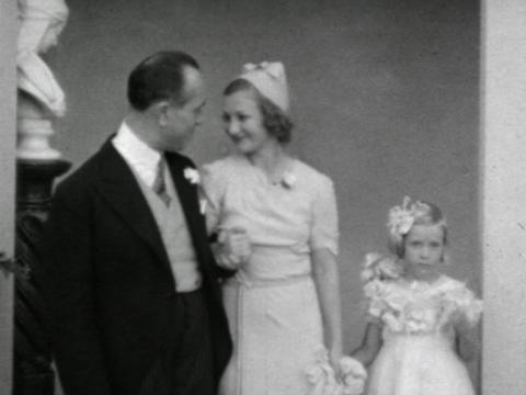 Hélène Kirsova at her wedding reception with her newly-wed husband, Danish Vice-Consul Erik Fischer, and a flower girl in 1938.