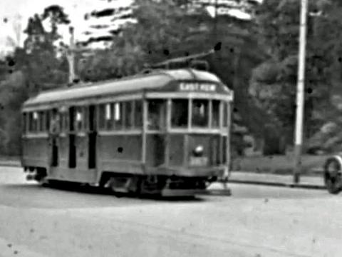 Tram travelling along Collins Street in Melbourne, circa 1920.
